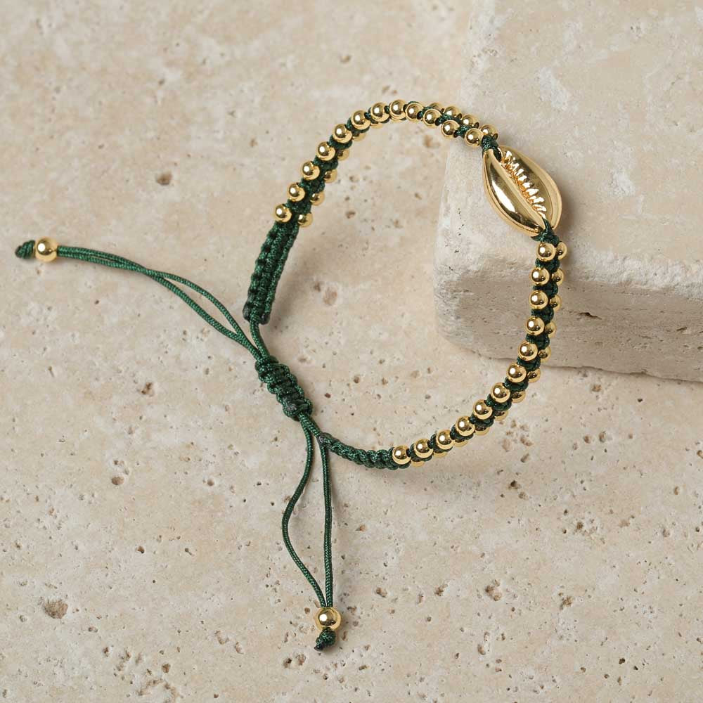 Bracciale intrecciato con conchiglia kauri oro verde scuro